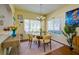 Dining room with clear table, comfortable chairs and beautiful interior decorating at 3909 45Th W Ter # 102, Bradenton, FL 34210