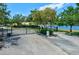 Exterior view of community entrance with gated entry and waterfront views at 3909 45Th W Ter # 102, Bradenton, FL 34210