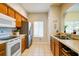 Practical kitchen features stainless steel appliances, tile floors and bright window at 3909 45Th W Ter # 102, Bradenton, FL 34210