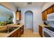 An open kitchen with wood cabinets, stainless steel sink, and light countertops at 3909 45Th W Ter # 102, Bradenton, FL 34210