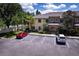 Exterior view of condo units, parking spaces, with two vehicles present at 3909 45Th W Ter # 102, Bradenton, FL 34210