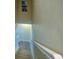 Carpeted staircase with white railings leading to the upper floor of the house at 3909 45Th W Ter # 102, Bradenton, FL 34210