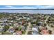 Aerial view of residential street with mature trees; home is centered at 403 Erie Ave, Tampa, FL 33606