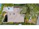 Aerial rooftop view showcases an adjacent water feature and lush surrounding greenery at 403 Erie Ave, Tampa, FL 33606