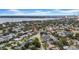 Expansive aerial view of a residential neighborhood with lush greenery and a glimpse of the bay in the background, showing location at 403 Erie Ave, Tampa, FL 33606