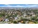 Aerial view shows residential neighborhood, mature trees, and skyline in the distance at 403 Erie Ave, Tampa, FL 33606
