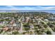 Aerial view of neighborhood highlighting mature trees and the surrounding waterfront at 403 Erie Ave, Tampa, FL 33606