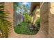 Exterior sideyard with grass, foliage, and privacy fence at 403 Erie Ave, Tampa, FL 33606