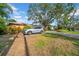 A view of the front exterior with car parked in driveway at 403 Erie Ave, Tampa, FL 33606