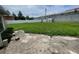 Spacious backyard with a shed, grassy lawn, concrete patio, and a privacy fence, offering outdoor living and recreational potential at 4611 W Mcelroy Ave, Tampa, FL 33611