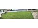 Expansive backyard with ample green space, a patio area, privacy fence, and the potential for landscaping or outdoor entertaining at 4611 W Mcelroy Ave, Tampa, FL 33611