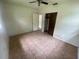 Neutral bedroom with tiled flooring, a closet, and views into adjacent rooms at 4611 W Mcelroy Ave, Tampa, FL 33611