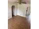 Bright living room with tiled flooring and an arched doorway leading to another area of the home at 4611 W Mcelroy Ave, Tampa, FL 33611