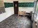 Covered patio with a decorative painted pattern, wood shelving, and lots of sunlight at 4611 W Mcelroy Ave, Tampa, FL 33611