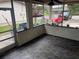 Enclosed outdoor patio with a view of the street, and vinyl flooring at 4611 W Mcelroy Ave, Tampa, FL 33611