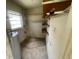 Small storage room with built in shelves and a window for natural light at 4611 W Mcelroy Ave, Tampa, FL 33611