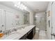 Bathroom features a double sink vanity, a separate toilet, and a walk-in shower at 4935 White Sanderling Ct, Tampa, FL 33619