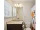 Bathroom with granite countertops, dark wood cabinets, a neutral wall and colorful shower curtain at 4935 White Sanderling Ct, Tampa, FL 33619