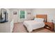 Bright bedroom with a window, neutral decor, and a comfortable bed at 4935 White Sanderling Ct, Tampa, FL 33619