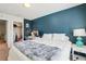 Comfortable bedroom features a walk-in closet, soft lighting, and calming teal accents at 4935 White Sanderling Ct, Tampa, FL 33619
