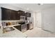 Modern kitchen featuring stainless steel appliances, granite countertops, and tiled floors at 4935 White Sanderling Ct, Tampa, FL 33619