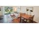 A comfortable living room with views of the backyard and dining room at 4935 White Sanderling Ct, Tampa, FL 33619