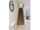 Carpeted staircase leading to the upper level, showcasing modern design at 4935 White Sanderling Ct, Tampa, FL 33619