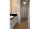 Well-lit bathroom with a black granite vanity, white cabinets, and a shower-tub combination at 501 Knights Run Ave # 2218, Tampa, FL 33602