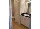 Clean and simple bathroom with granite countertop, white cabinets and tiled floors at 501 Knights Run Ave # 2218, Tampa, FL 33602