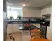 Bright kitchen with white cabinets, stainless-steel appliances, and a cozy breakfast nook at 501 Knights Run Ave # 2218, Tampa, FL 33602