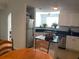 Kitchen with stainless-steel appliances, white cabinetry, and an island with seating at 501 Knights Run Ave # 2218, Tampa, FL 33602