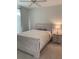 Calm main bedroom featuring a neutral color palette, soft lighting, and carpeted floors at 501 Knights Run Ave # 2218, Tampa, FL 33602