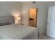 Spacious main bedroom with carpeted floors and a view into the ensuite bathroom at 501 Knights Run Ave # 2218, Tampa, FL 33602