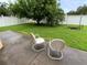 A spacious backyard with a white fence and lush green grass, perfect for relaxing at 5154 Balsam Dr, Land O Lakes, FL 34639