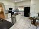 Modern kitchen featuring a center island, nook, and stainless steel appliances at 5154 Balsam Dr, Land O Lakes, FL 34639
