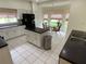 Modern kitchen with a center island, breakfast nook, and black appliances at 5154 Balsam Dr, Land O Lakes, FL 34639