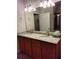 Bathroom vanity with double sinks, granite countertops, and chrome faucets at 5473 Sunset Falls Dr, Apollo Beach, FL 33572
