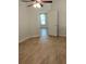 Bedroom with tile flooring, ceiling fan and a view to the next room at 5473 Sunset Falls Dr, Apollo Beach, FL 33572