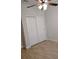 Bedroom with sliding closet doors and tile flooring at 5473 Sunset Falls Dr, Apollo Beach, FL 33572