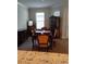 Formal dining room showcasing a vintage table and chairs, plus a decorative china cabinet by a bright window at 5473 Sunset Falls Dr, Apollo Beach, FL 33572