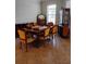 Formal dining room showcasing a vintage table and chairs, plus a decorative china cabinet by a bright window at 5473 Sunset Falls Dr, Apollo Beach, FL 33572