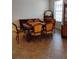 Formal dining room showcasing a vintage table and chairs, plus a decorative china cabinet by a bright window at 5473 Sunset Falls Dr, Apollo Beach, FL 33572