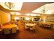 Versatile event space featuring ample seating, elegant chandeliers, and bright natural lighting at 5473 Sunset Falls Dr, Apollo Beach, FL 33572