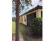 Exterior shot of a home featuring a screened-in patio and well-maintained lawn and landscaping at 5473 Sunset Falls Dr, Apollo Beach, FL 33572