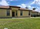 Charming single-story home featuring a well-manicured lawn and a welcoming entrance with a tiled roof at 5473 Sunset Falls Dr, Apollo Beach, FL 33572