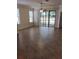 Bright living room featuring tile floors, a ceiling fan, and a large sliding glass door to the patio at 5473 Sunset Falls Dr, Apollo Beach, FL 33572