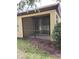 Exterior view of a screened-in patio area, perfect for enjoying the outdoors without the bugs at 5473 Sunset Falls Dr, Apollo Beach, FL 33572