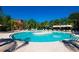 Outdoor swimming pool in community with lots of palm trees providing shade for hot summer days at 5473 Sunset Falls Dr, Apollo Beach, FL 33572
