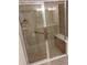 Shower with a glass door, tile walls, shower head, and a seat at 5473 Sunset Falls Dr, Apollo Beach, FL 33572