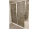 Shower with glass door, tile, and a handrail at 5473 Sunset Falls Dr, Apollo Beach, FL 33572